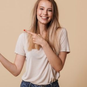 demo-attachment-1742-portrait-of-a-happy-casual-girl-pointing-finger-AXTU56E